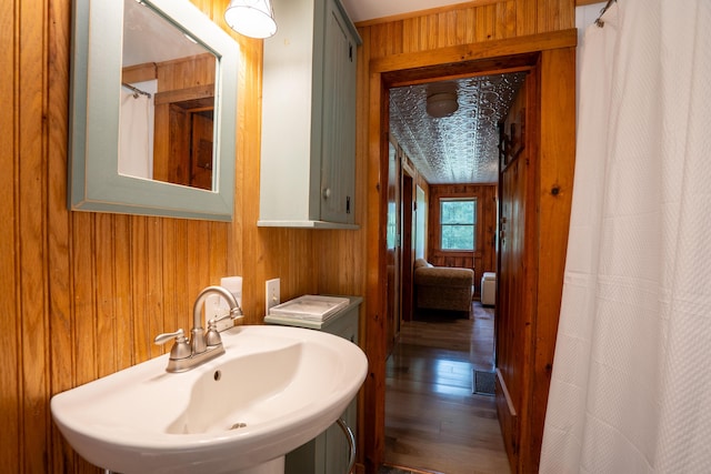 260 Coombs Rd, Brunswick, ME 04011 - full bath with wood walls, wood finished floors, and a shower with shower curtain