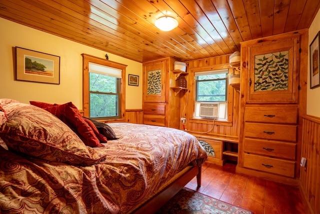 260 Coombs Rd, Brunswick, ME 04011 - bedroom with wooden walls, cooling unit, multiple windows, wooden ceiling, and wainscoting