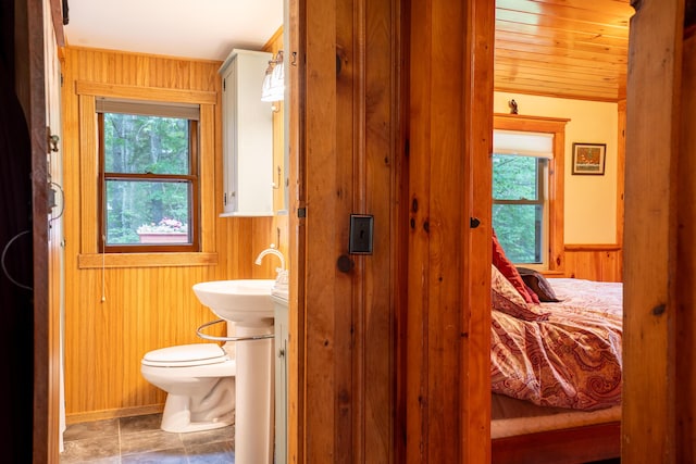 260 Coombs Rd, Brunswick, ME 04011 - ensuite bathroom featuring wooden walls, healthy amount of natural light, a wainscoted wall, and wooden ceiling