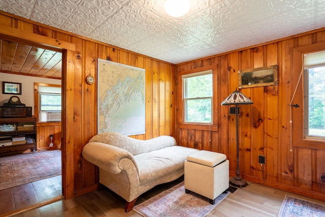 260 Coombs Rd, Brunswick, ME 04011 - living area with wooden walls, wood-type flooring, an ornate ceiling, and ornamental molding