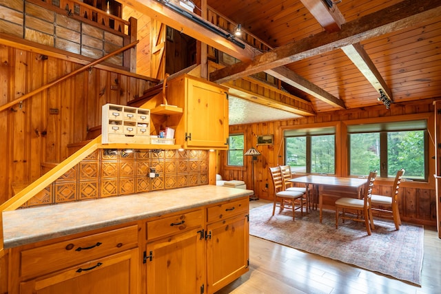 260 Coombs Rd, Brunswick, ME 04011 - kitchen with wood walls, light wood finished floors, a wooden ceiling with exposed beams, and light countertops
