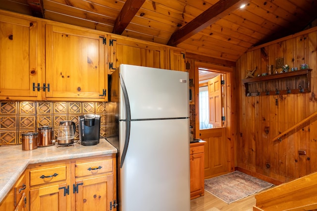 260 Coombs Rd, Brunswick, ME 04011 - kitchen with freestanding refrigerator, decorative backsplash, light wood-style floors, wood ceiling, and light countertops