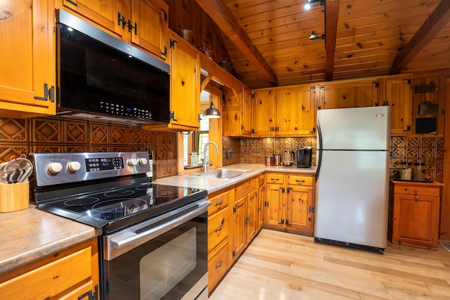 260 Coombs Rd, Brunswick, ME 04011 - kitchen with stainless steel appliances, wooden ceiling, decorative backsplash, light wood-style flooring, and light countertops