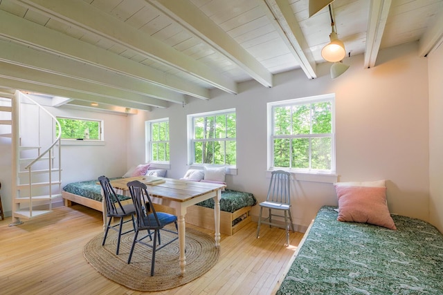265 Greenacre Rd, Lincolnville, ME 04849 - dining room featuring healthy amount of natural light, wood-type flooring, and beam ceiling