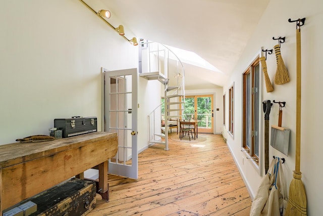 265 Greenacre Rd, Lincolnville, ME 04849 - corridor with french doors, vaulted ceiling, and hardwood / wood-style flooring
