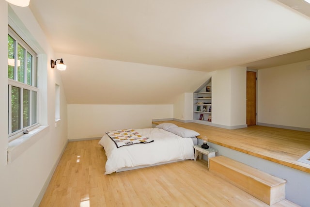 265 Greenacre Rd, Lincolnville, ME 04849 - bedroom with wood finished floors and lofted ceiling