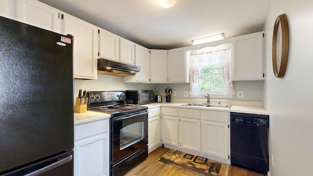 15 Cattail Ln, Monmouth, ME 04259 - kitchen featuring black appliances, under cabinet range hood, light wood-type flooring, white cabinets, and light countertops
