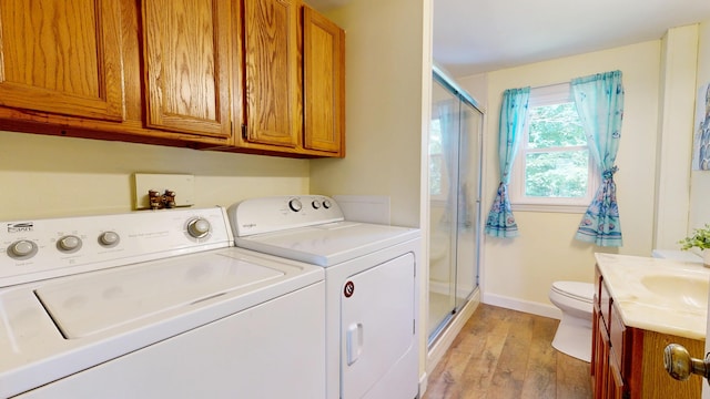 15 Cattail Ln, Monmouth, ME 04259 - washroom with washer and clothes dryer and light wood-type flooring