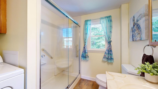 15 Cattail Ln, Monmouth, ME 04259 - bathroom featuring wood finished floors, a shower stall, vanity, and washer / clothes dryer