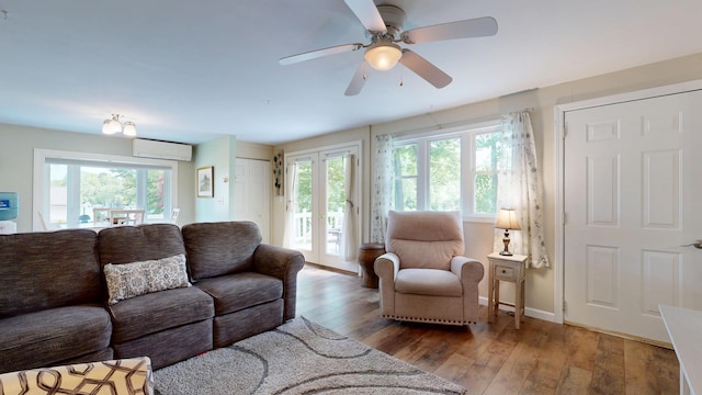 15 Cattail Ln, Monmouth, ME 04259 - living area with an AC wall unit, plenty of natural light, ceiling fan, and wood-type flooring