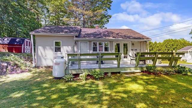 15 Cattail Ln, Monmouth, ME 04259 - back of house with a shed, a yard, a deck, and roof with shingles