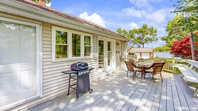 15 Cattail Ln, Monmouth, ME 04259 - deck featuring grilling area, outdoor dining space, french doors, and a water view