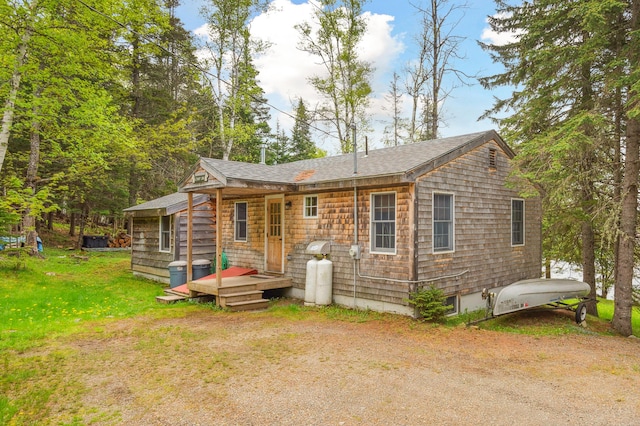 100 Bear Path, Rangeley, ME 04970 - back of house with a yard and roof with shingles