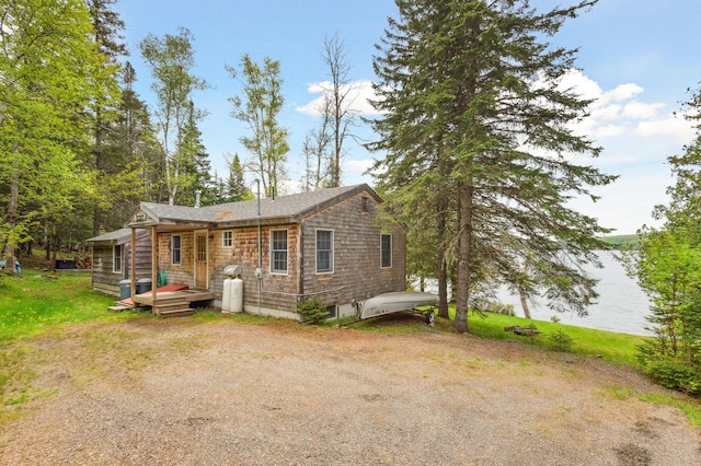 100 Bear Path, Rangeley, ME 04970 - view of front of property featuring a front lawn and a wooden deck