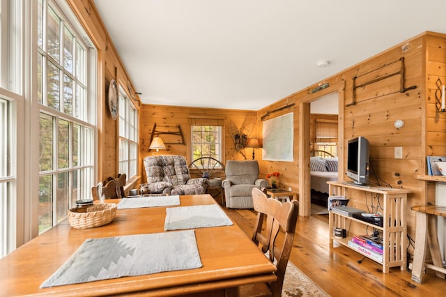 100 Bear Path, Rangeley, ME 04970 - dining area featuring wood walls and hardwood / wood-style floors