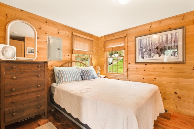 100 Bear Path, Rangeley, ME 04970 - bedroom with wood walls, electric panel, and wood finished floors