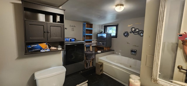 48 Gary St, Paris, ME 04281 - bathroom with a whirlpool tub, lofted ceiling, and washer / clothes dryer