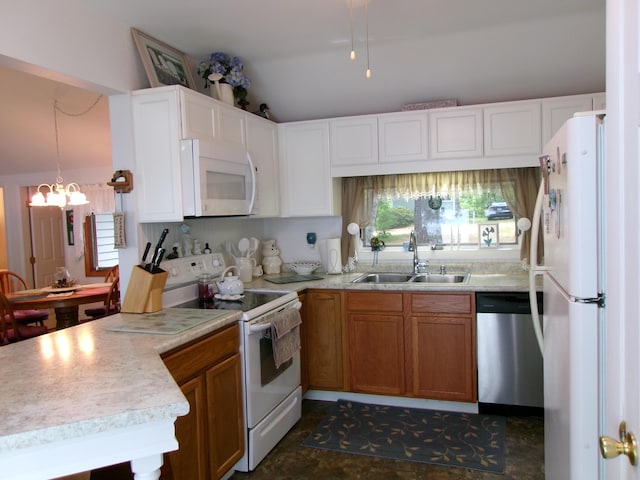 24 Paradise Dr, Monmouth, ME 04259 - kitchen featuring white appliances, lofted ceiling, light countertops, and plenty of natural light