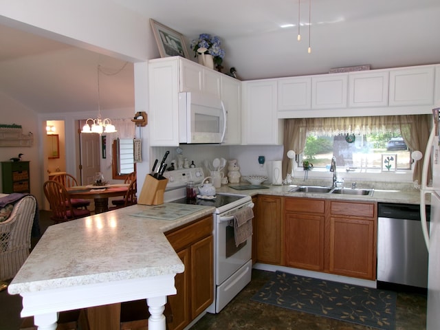 24 Paradise Dr, Monmouth, ME 04259 - kitchen with white appliances, lofted ceiling, a peninsula, a chandelier, and light countertops