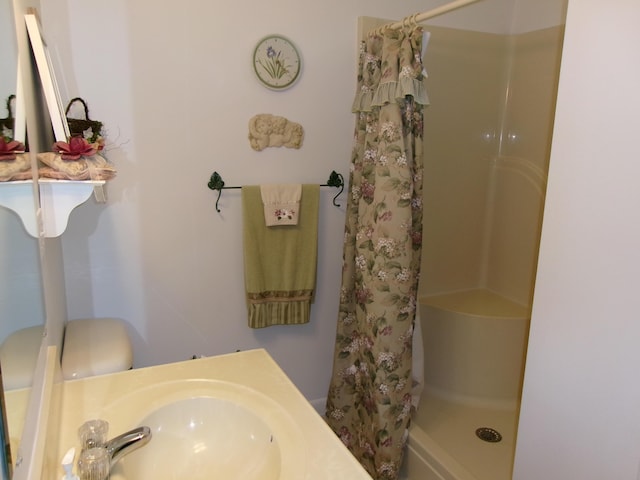 24 Paradise Dr, Monmouth, ME 04259 - bathroom with curtained shower and vanity