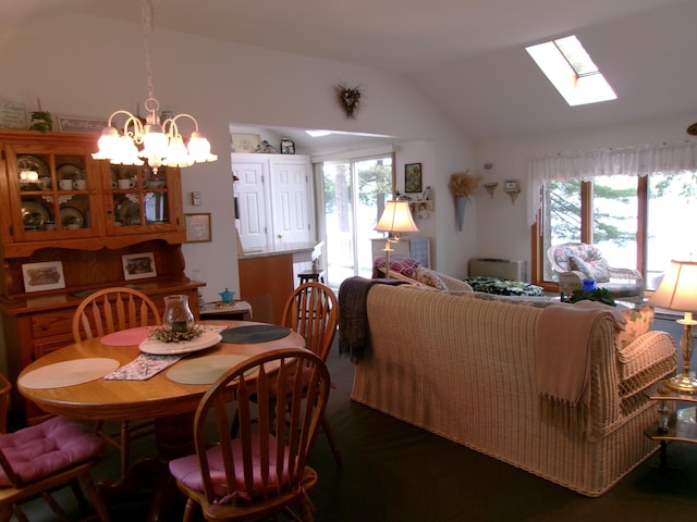 24 Paradise Dr, Monmouth, ME 04259 - dining area with a skylight, vaulted ceiling, and a chandelier