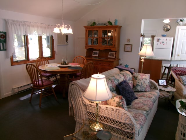 24 Paradise Dr, Monmouth, ME 04259 - dining room with a baseboard heating unit, a chandelier, vaulted ceiling, and an AC wall unit