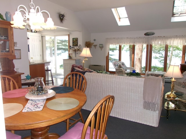 24 Paradise Dr, Monmouth, ME 04259 - dining space with vaulted ceiling, a chandelier, and a skylight