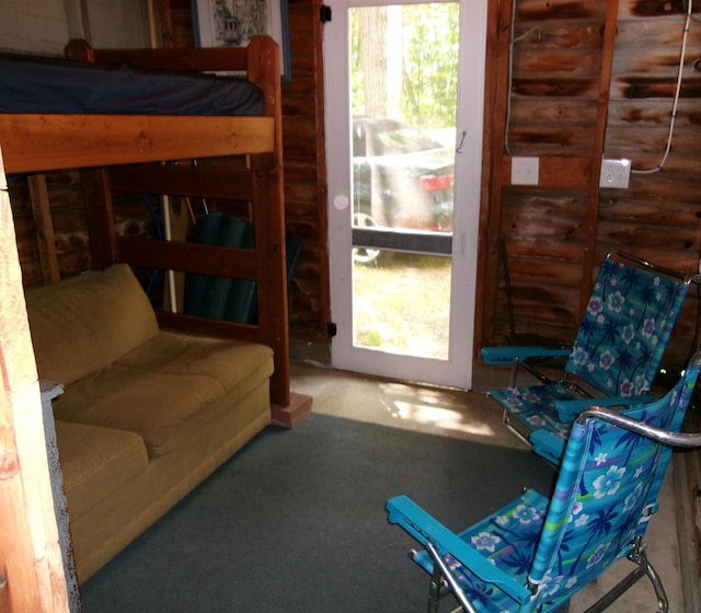 24 Paradise Dr, Monmouth, ME 04259 - bedroom featuring rustic walls and carpet flooring