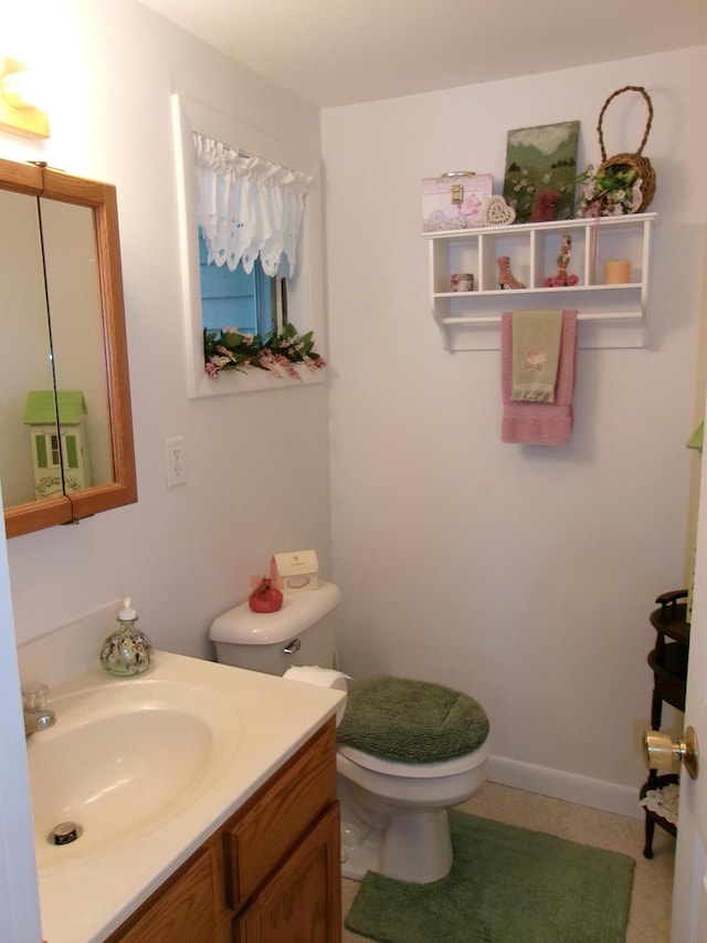 24 Paradise Dr, Monmouth, ME 04259 - bathroom with toilet and vanity
