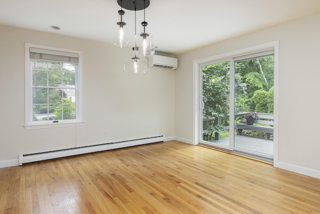 3 Cape Woods Dr Unit 3, Cape Elizabeth, ME 04107 - spare room featuring a baseboard heating unit, an AC wall unit, and light wood-style floors