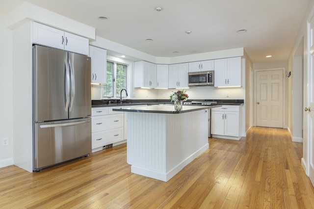 3 Cape Woods Dr Unit 3, Cape Elizabeth, ME 04107 - kitchen featuring appliances with stainless steel finishes, dark countertops, light wood finished floors, white cabinetry, and recessed lighting