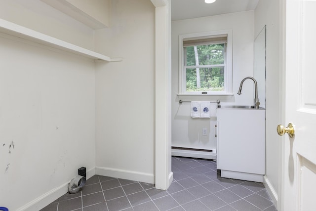 3 Cape Woods Dr Unit 3, Cape Elizabeth, ME 04107 - laundry room featuring baseboard heating and dark tile patterned floors