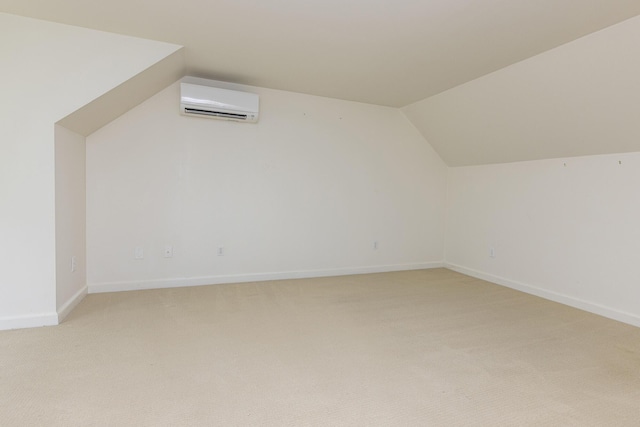 3 Cape Woods Dr Unit 3, Cape Elizabeth, ME 04107 - bonus room with an AC wall unit, vaulted ceiling, and light carpet