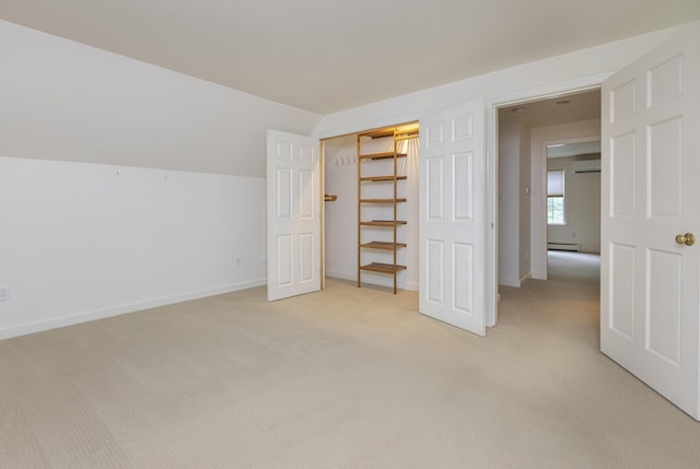 3 Cape Woods Dr Unit 3, Cape Elizabeth, ME 04107 - unfurnished bedroom featuring an AC wall unit, light carpet, and baseboard heating