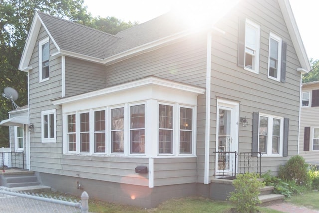 4 E St, Sanford, ME 04073 - view of property exterior featuring roof with shingles