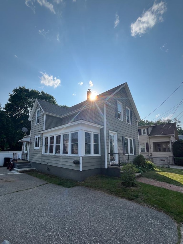 4 E St, Sanford, ME 04073 - view of home's exterior with a chimney