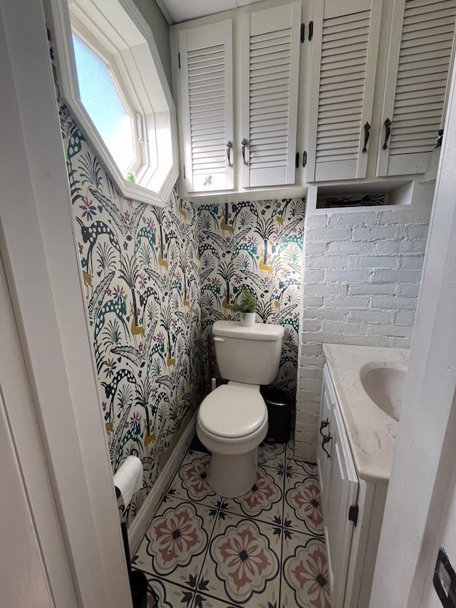 4 E St, Sanford, ME 04073 - bathroom featuring wallpapered walls, vanity, and tile patterned floors