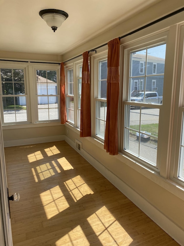 4 E St, Sanford, ME 04073 - unfurnished sunroom with healthy amount of natural light and wood finished floors