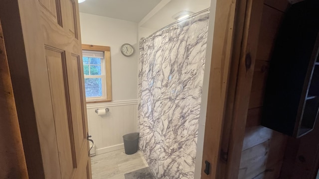 87 Perch Pt, Shapleigh, ME 04076 - full bathroom with wainscoting, wood finished floors, curtained shower, and a decorative wall