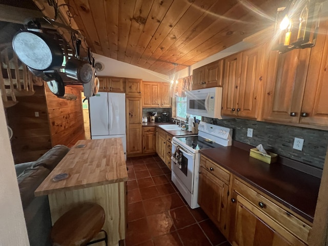 87 Perch Pt, Shapleigh, ME 04076 - kitchen with white appliances, backsplash, vaulted ceiling, dark tile patterned flooring, and wooden counters
