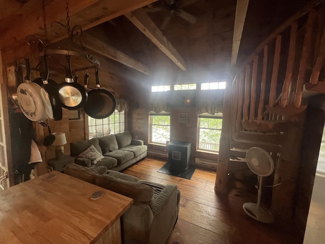 87 Perch Pt, Shapleigh, ME 04076 - living room with a wood stove, hardwood / wood-style floors, a towering ceiling, and baseboard heating