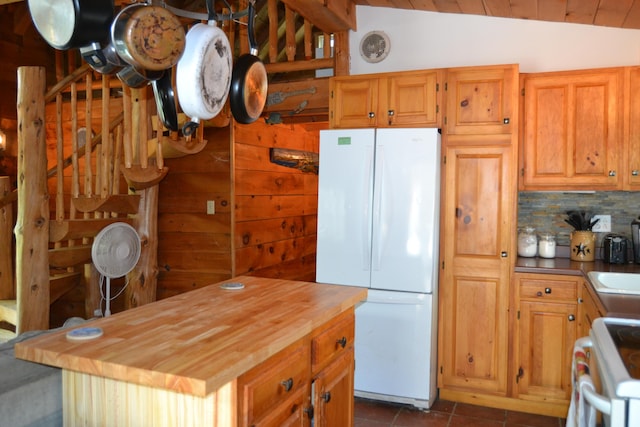 87 Perch Pt, Shapleigh, ME 04076 - kitchen with white appliances, wooden counters, vaulted ceiling, decorative backsplash, and dark tile patterned floors