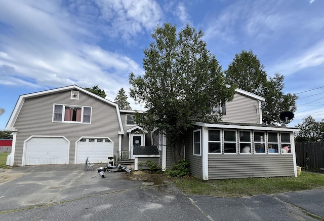 257 N Ave, Skowhegan, ME 04976 - colonial inspired home featuring asphalt driveway, a gambrel roof, and an attached garage