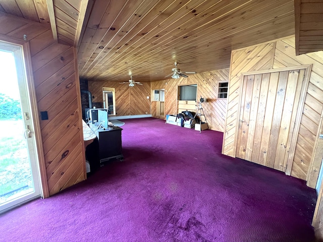 257 N Ave, Skowhegan, ME 04976 - living area with carpet floors, wooden walls, wooden ceiling, a desk, and ceiling fan