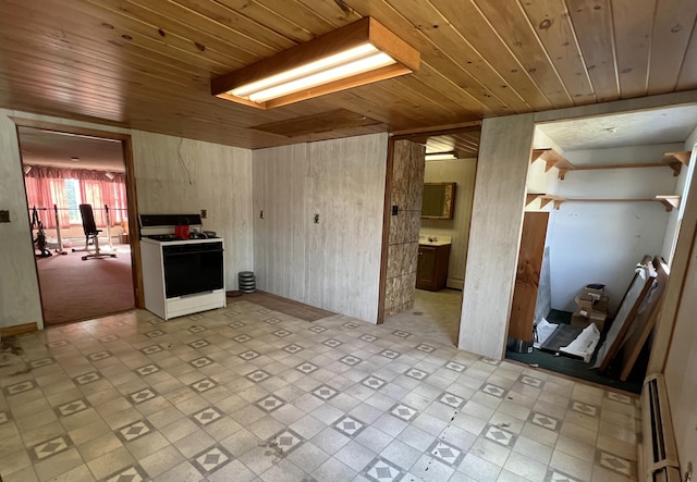 257 N Ave, Skowhegan, ME 04976 - kitchen with white range oven, wood ceiling, a baseboard heating unit, and light flooring