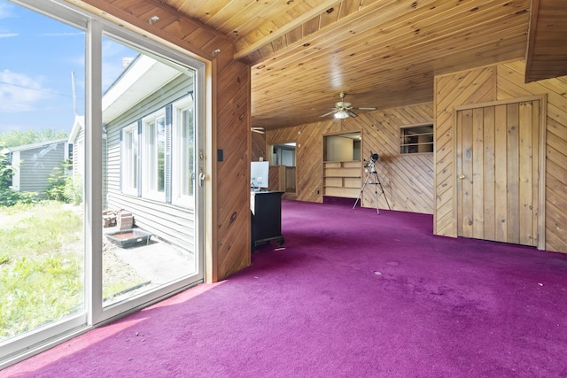 257 N Ave, Skowhegan, ME 04976 - spare room with wooden walls, healthy amount of natural light, carpet flooring, and a ceiling fan