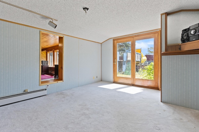257 N Ave, Skowhegan, ME 04976 - empty room featuring a baseboard heating unit, carpet flooring, a textured ceiling, and french doors