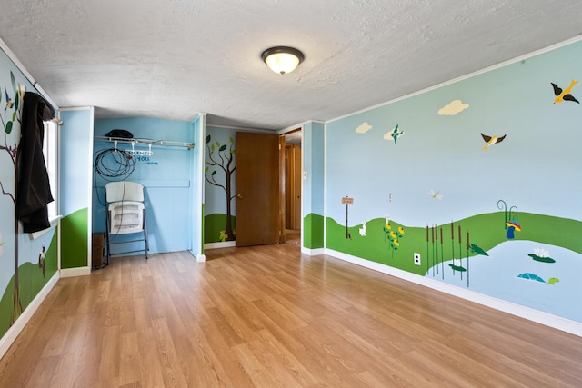 257 N Ave, Skowhegan, ME 04976 - spare room featuring a textured ceiling, wood finished floors, and crown molding