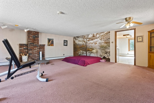 257 N Ave, Skowhegan, ME 04976 - carpeted bedroom featuring a baseboard heating unit, a textured ceiling, and wallpapered walls