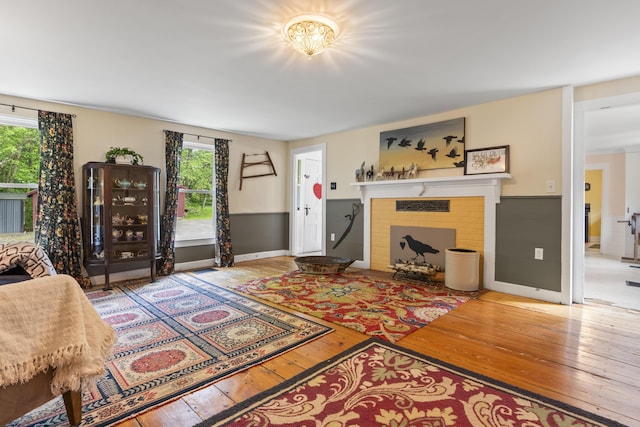 1548 Main St, Readfield, ME 04355 - living area featuring hardwood / wood-style flooring, plenty of natural light, and a fireplace